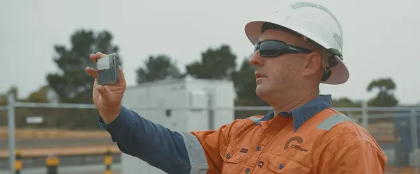 Crew member capturing site evidence on a phone